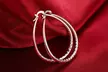 925 Sterling Silver Diamond-Cut Oval Hoop Earrings - Second Medium