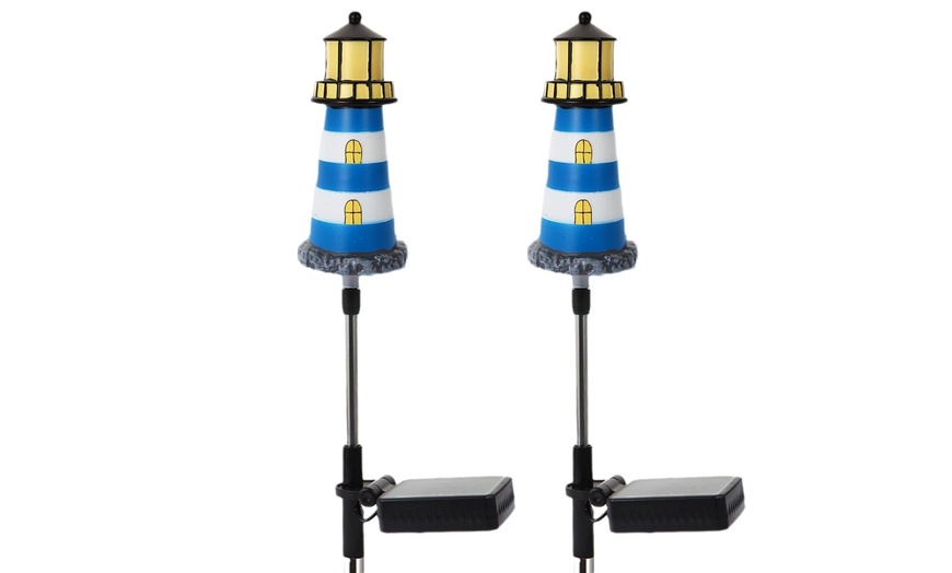 Image 7: One, Two or Four Solar Powered Lighthouse Shaped Garden Lights