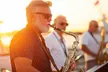 Unwind on NYC's Two-Hour Sunset Cruise with Live DJ and Games at NYC Water Cruises (Up To 50% Off) - Second Medium
