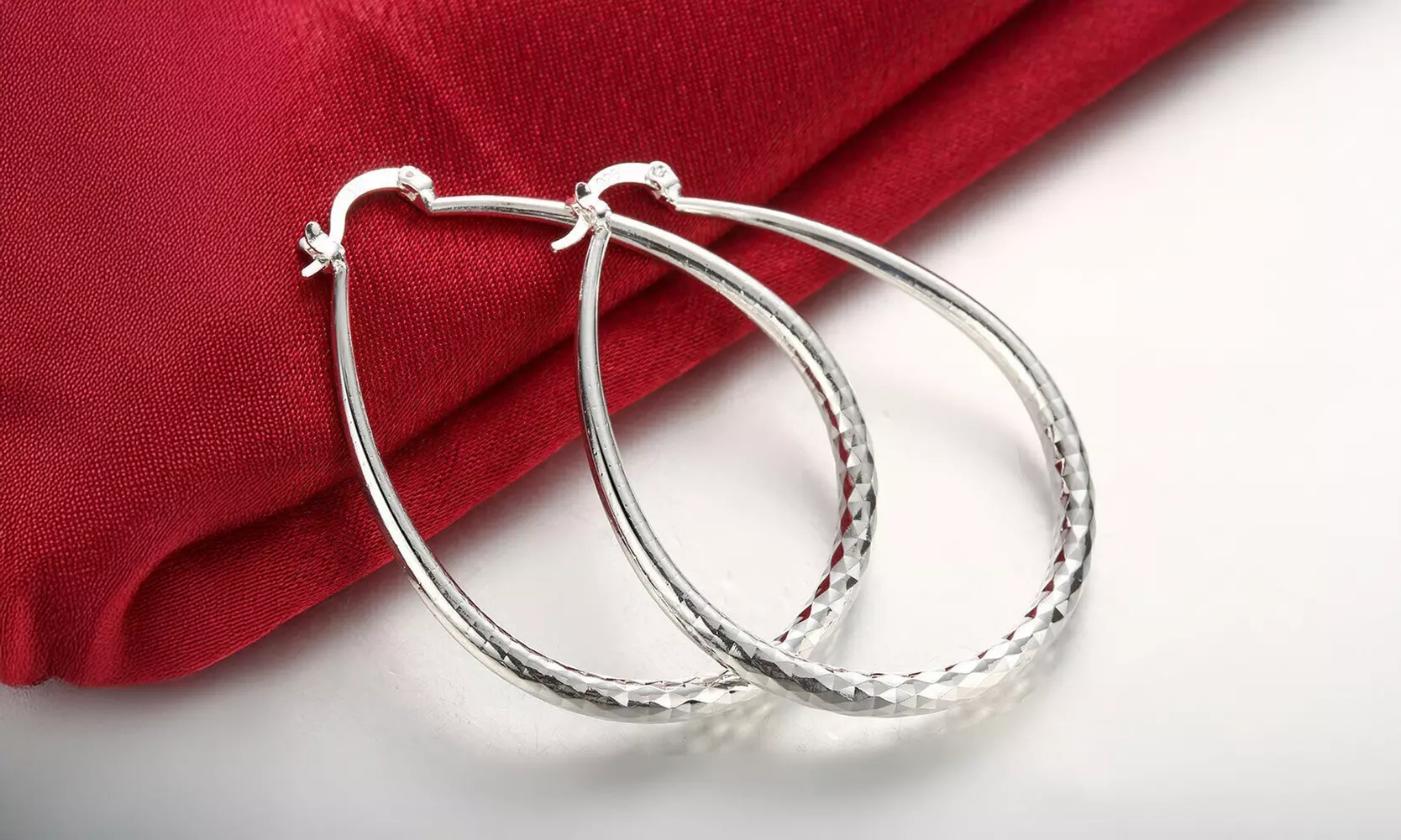 925 Sterling Silver Diamond-Cut Oval Hoop Earrings