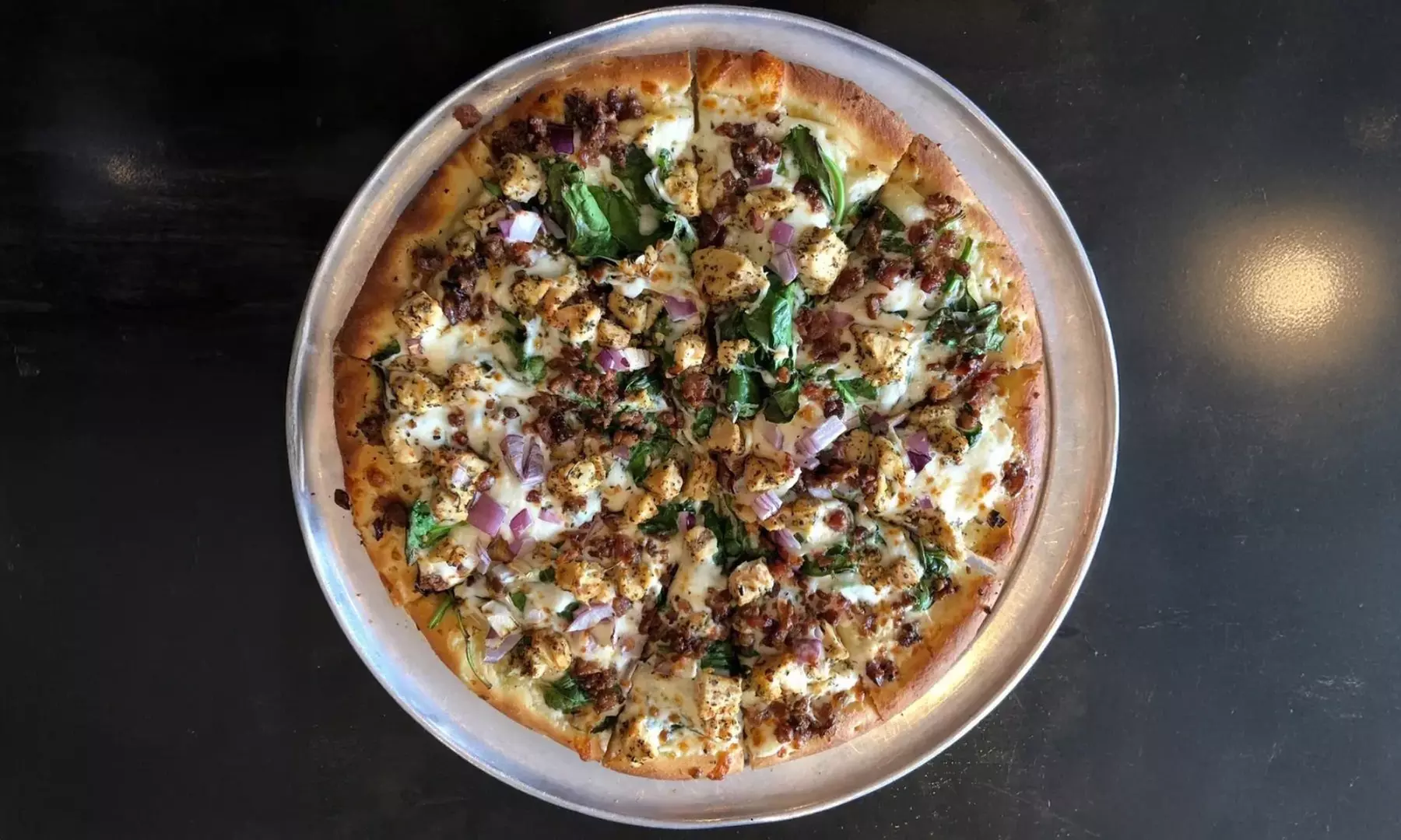 Enjoy Artisan Pizza, Specialty Sandwiches, Salads, Wings & Great Beers