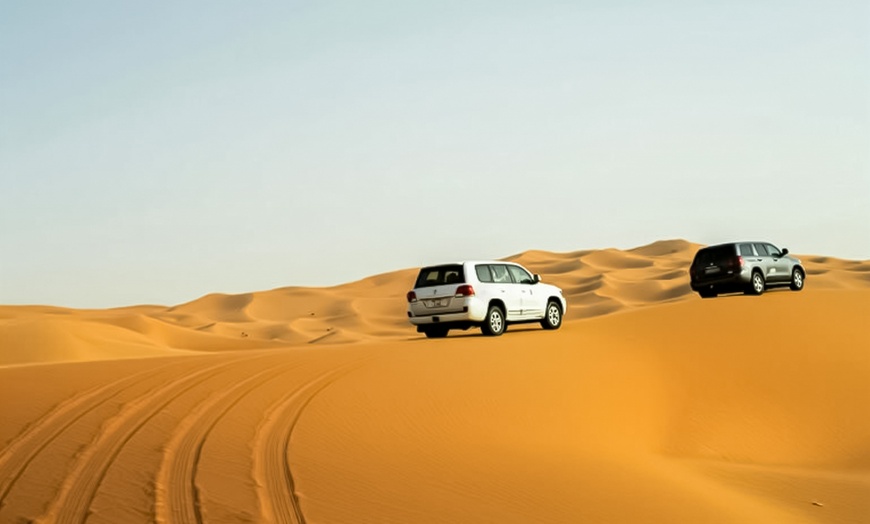 Image 3: Evening Desert Safari + BBQ, Sandboarding & Camel Ride For Up to 6