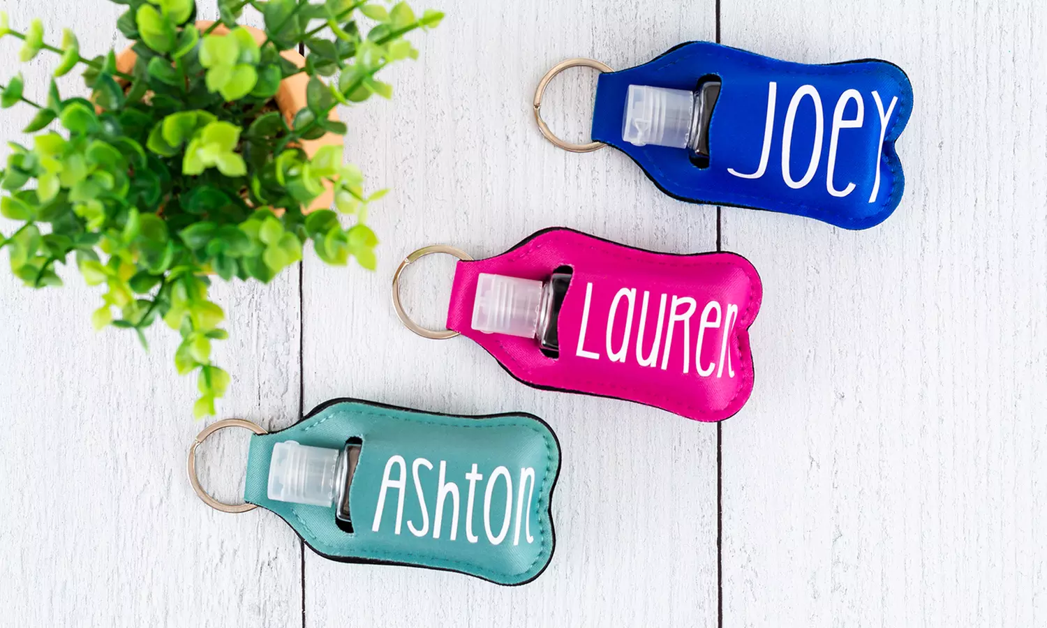 Personalized Hand Sanitizer Keychain Holders from VioletFox (Up to 71% Off). Three Options Available. - Primary Image