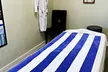 60-Minute Combo Massage including 30-Minute Back and 30-Minute Facial with Hot Stone Treatment (Up to 29% Off) - Second Medium