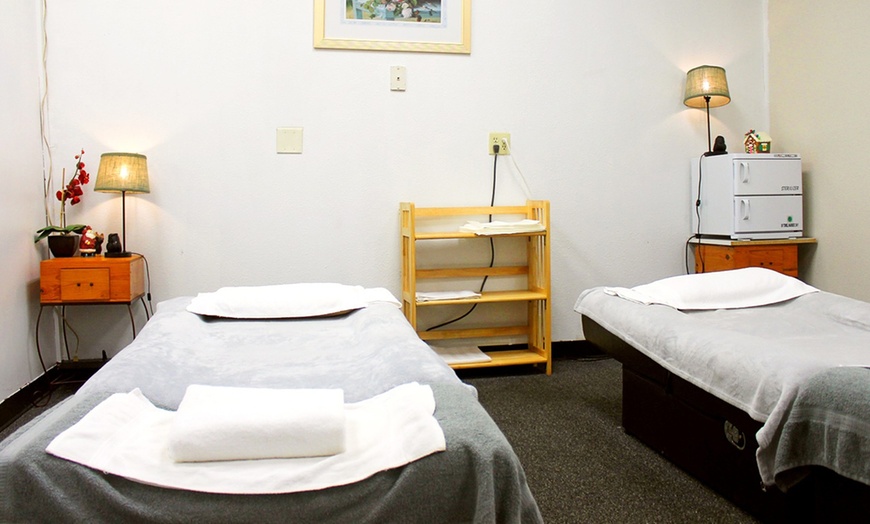 Image 2: Massages for 1 or 2 with Aromatherapy and Optional Hot Stones 