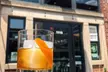 2 or 4 Cocktails or 16 oz Beers & 2 or 4 1-L Bottles of Vodka to Take Home for 2 or 4 People (Up to 53% Off) - Second Medium