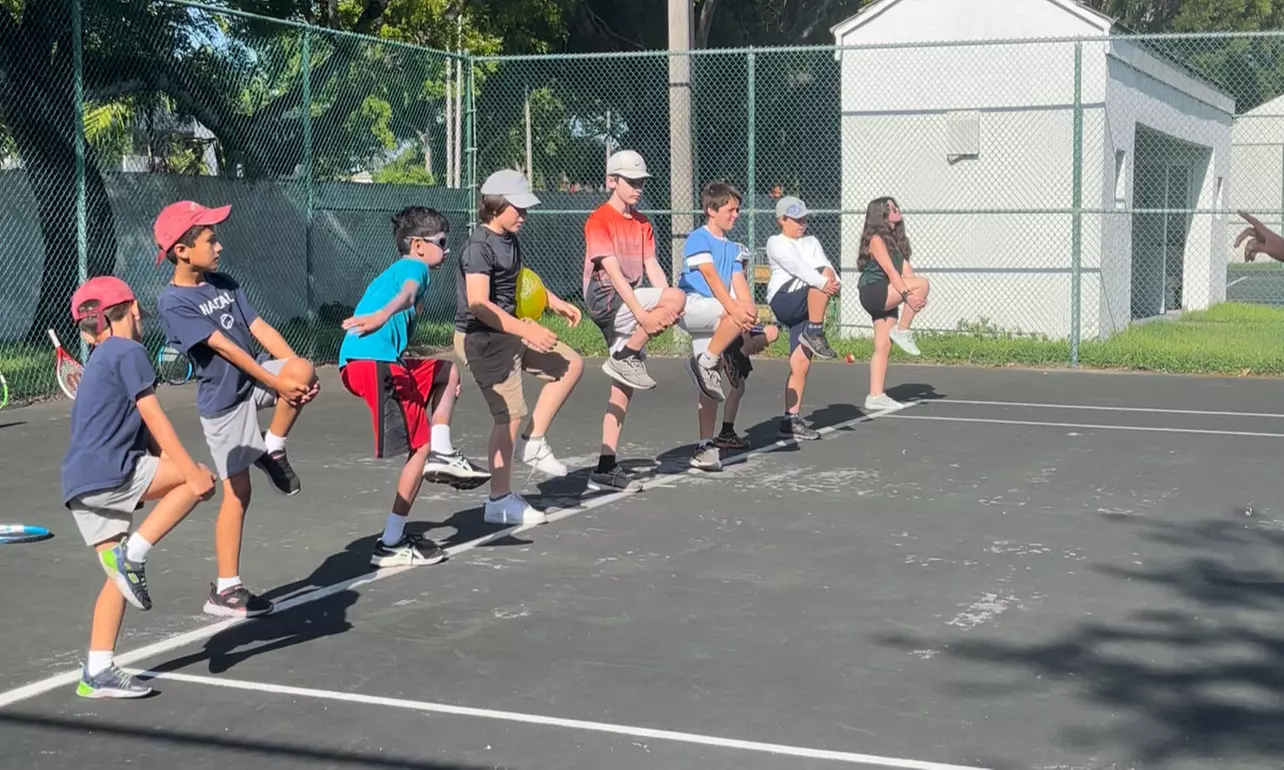 Ace Your Game with a Private Tennis Lesson for Up to Four
