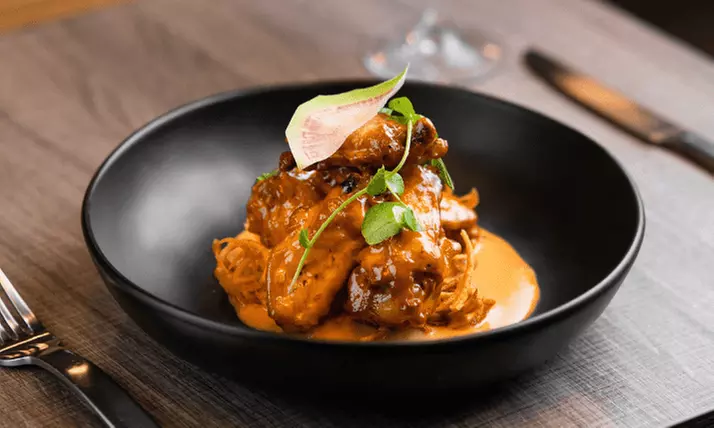 Indulge in a Cozy Dinner for Two or Four with Cocktails