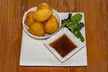 Savor & Sip Caribbean Cuisine: One, Two, or Four Drinks and Appetizers in a Cozy Atmosphere (Up To 35% Off) - Second Medium