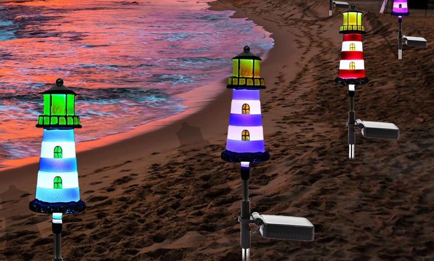 Image 4: One, Two or Four Solar Powered Lighthouse Shaped Garden Lights