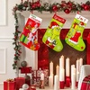 Image 5: 4-Pack Grinch-Inspired Christmas Stockings 