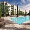 Image 1: Condo Resort With Mediterranean-Style Suites & Pool