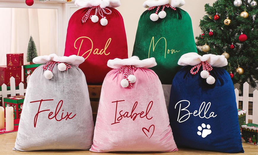 Image 2: Surprise loved ones with a festive, Personalized Santa Delivery Bag