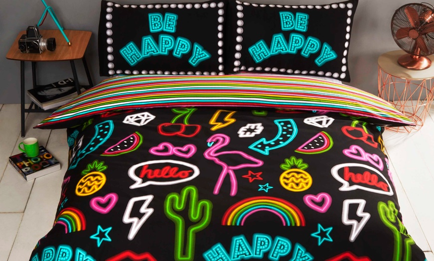 Image 1: Reversible Be Happy Neon Design Duvet Set