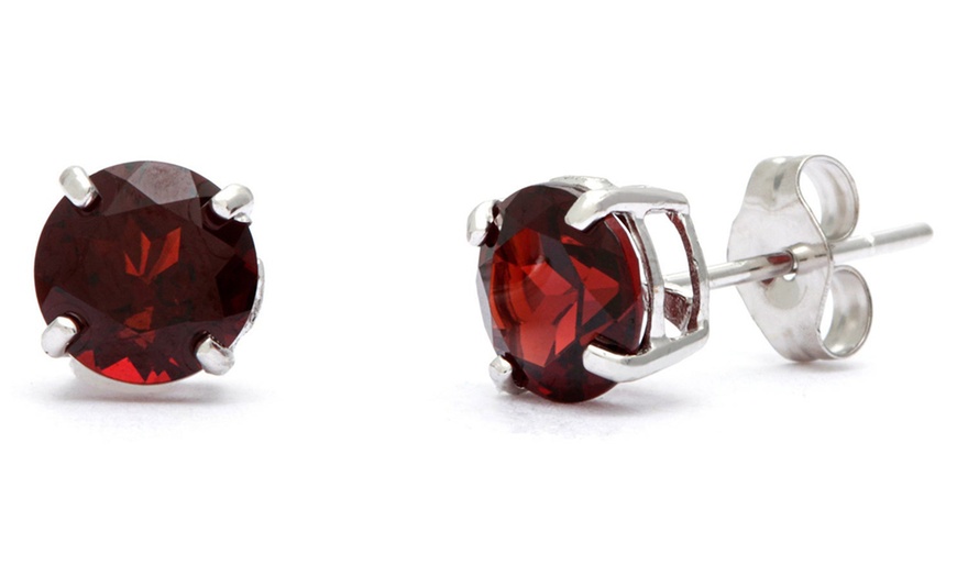 Image 1: 18k White Gold Plated 1 Cttw Round Garnet Stud Earrings.