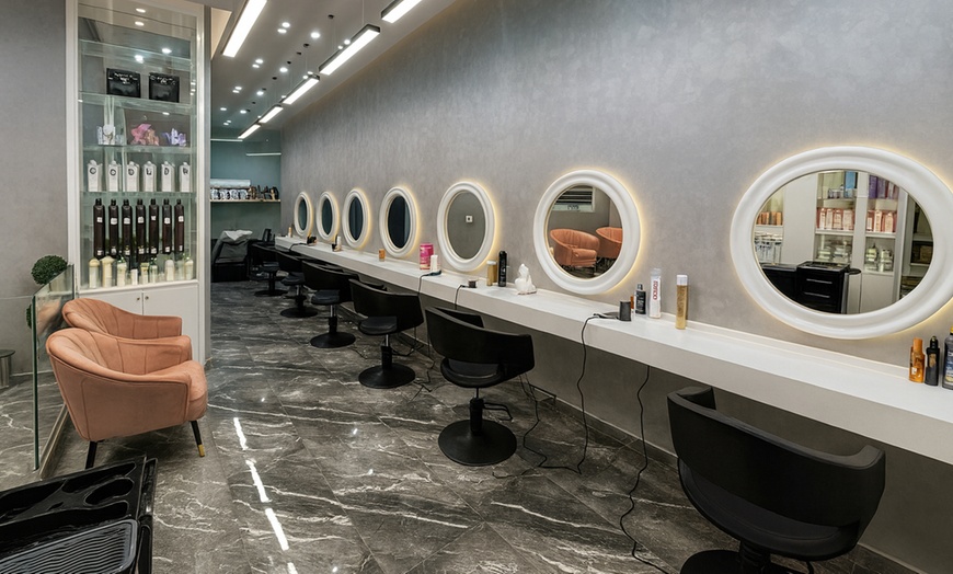 Image 1: Haircut, Blow-Dry, and Mani-Pedi Packages