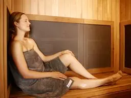 Revitalize with One or Four Infrared Sauna & Add-On Treatments