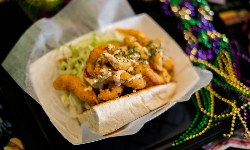 Image 10: Two Po'Boys, Meals for Two or Four With Beignets, and $50–$75 Credits