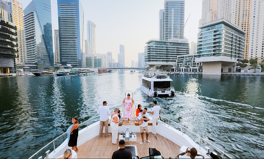 Image 1: 1.5 Hours Shared Marina Canal Yacht Tour for One Child or Adult