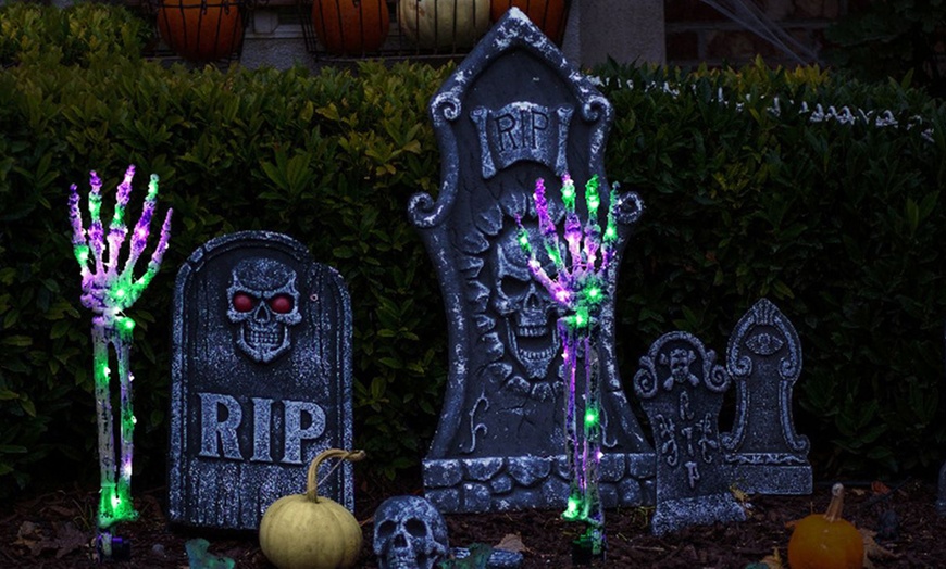 Image 1: Five-Pack Halloween Solar Skull Hand Ground Lights