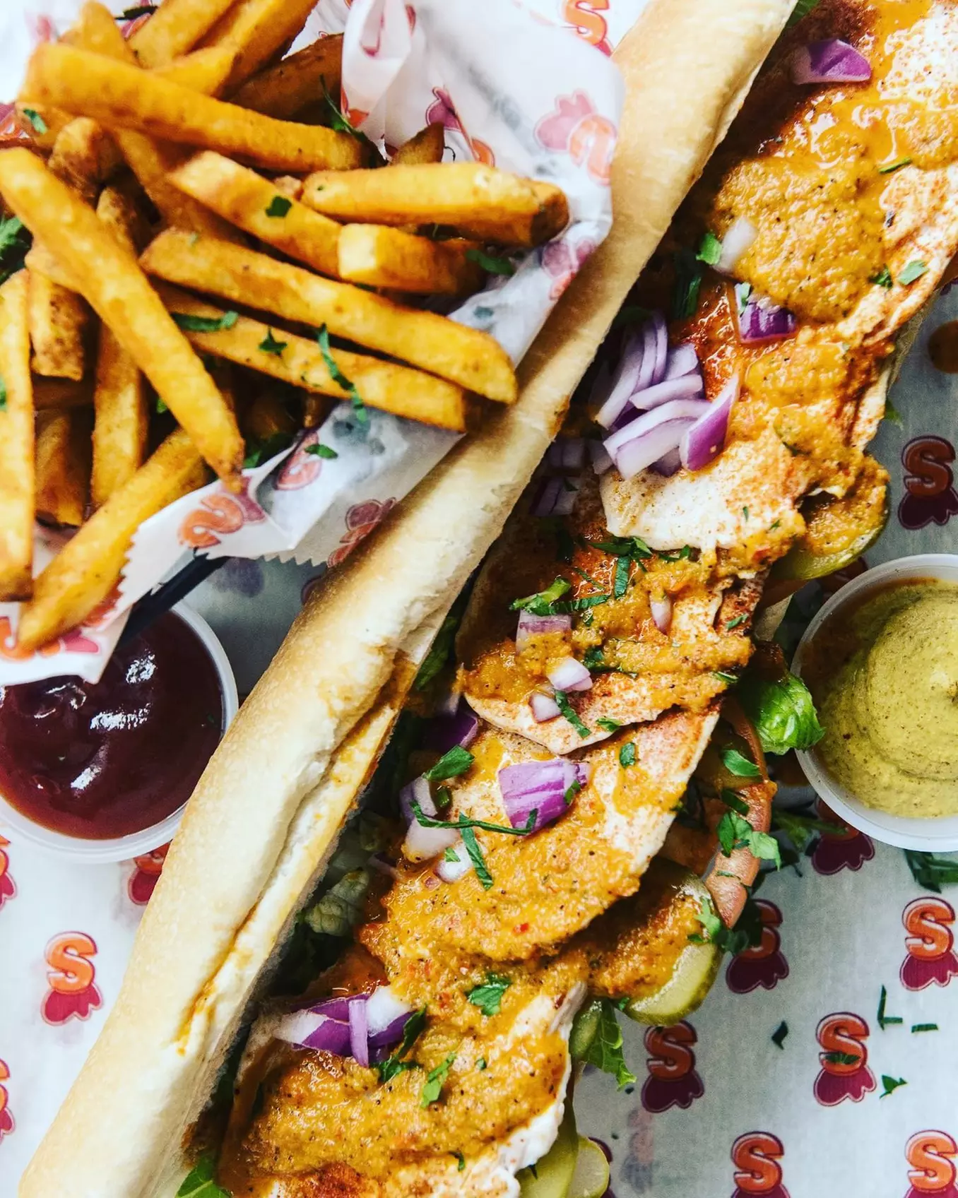$25 or $50 Towards Food and Drink or Full/Half Sandwich + Chips or Fries & More @ Schnitzi (Up to  27% Off) - Second Medium