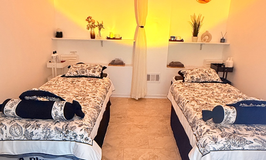 Image 1: 60 or 90-Minute Swedish Massage & Hot Stones with Optional Reflexology