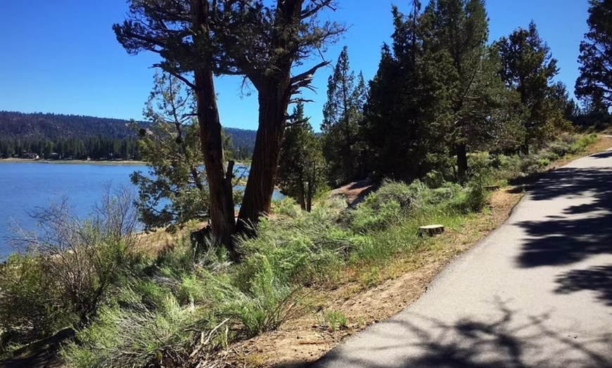 Image 16: Relax by the pool with lake views and mountain breezes