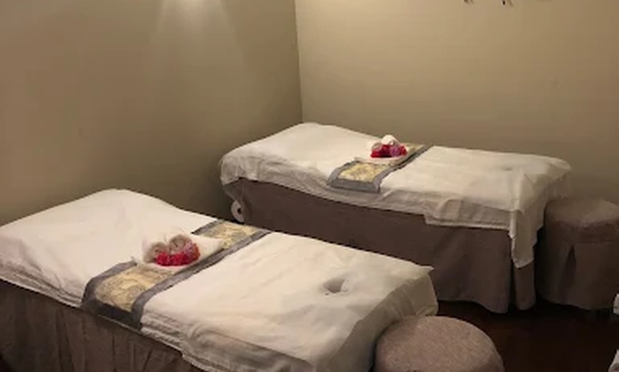 Image 2: Relax & Reconnect with 60-Min Hot-Stone Massages – Single or Couples