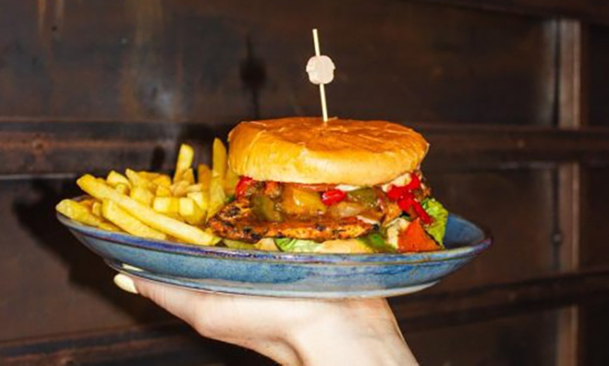 Image 3: Main Course with Glass of Wine, Beer, or Soft Drink at Saint Jude’s 