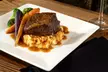 Authentic French Dining & Epicurean Wines for Two or Four, or Dining Credit at Daytona Beach (Up to 46% Off) - Second Medium