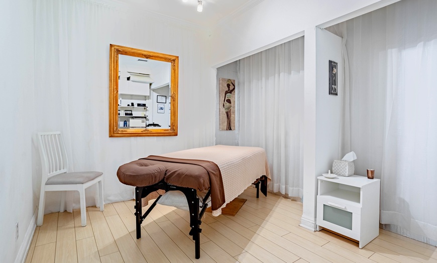 Image 2: Relax w/ 60-Min Tailored Massage, Deep Tissue with Optional Hot Rocks 