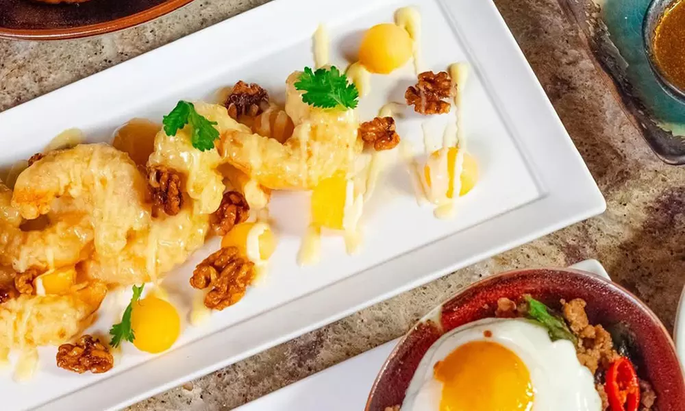 Savor $50 Dining Credit or Dinner with Cocktails for Two or Four