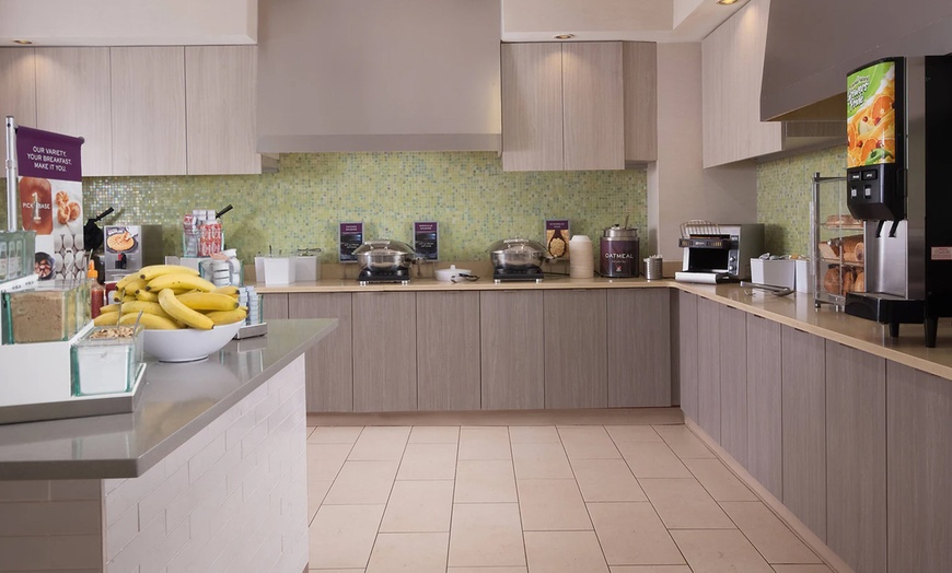 Image 11: Spacious suites, free breakfast, pool, and easy access to beaches