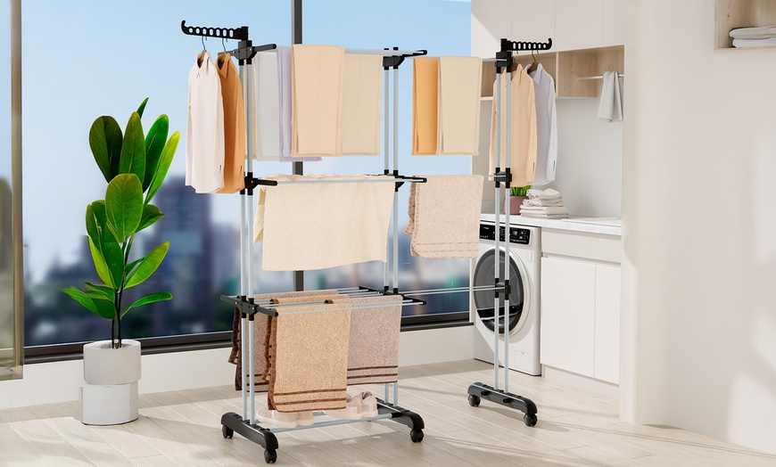 Image 1: Black or Blue Four-Tier Foldable Laundry Dryer Rack Indoor or Outdoor
