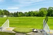 Experience Buzzard Cove's driving range and clubhouse delights with up to 20% off - Second Medium