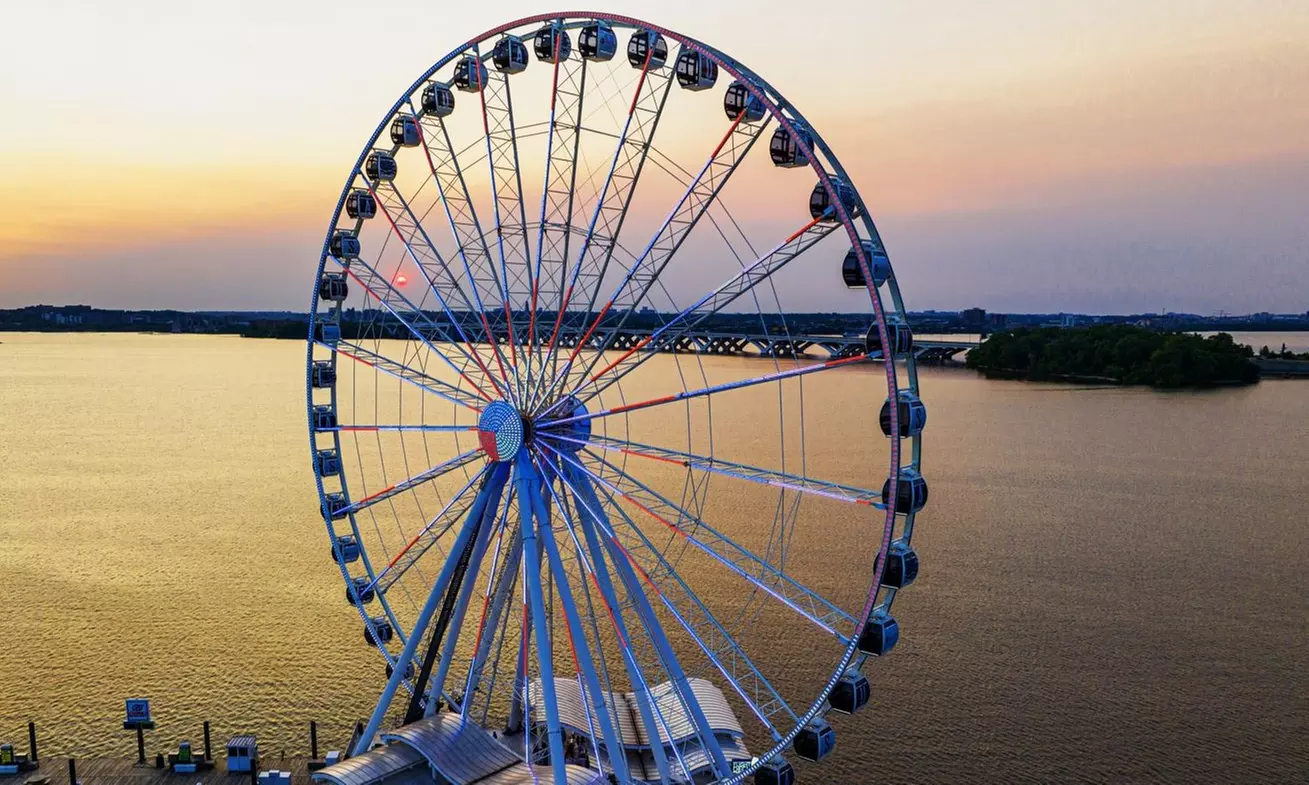 Experience a Ride on The Capital Wheel in DC. Enjoy Stunning Views, Fireworks, and More (Up to 37% Off)