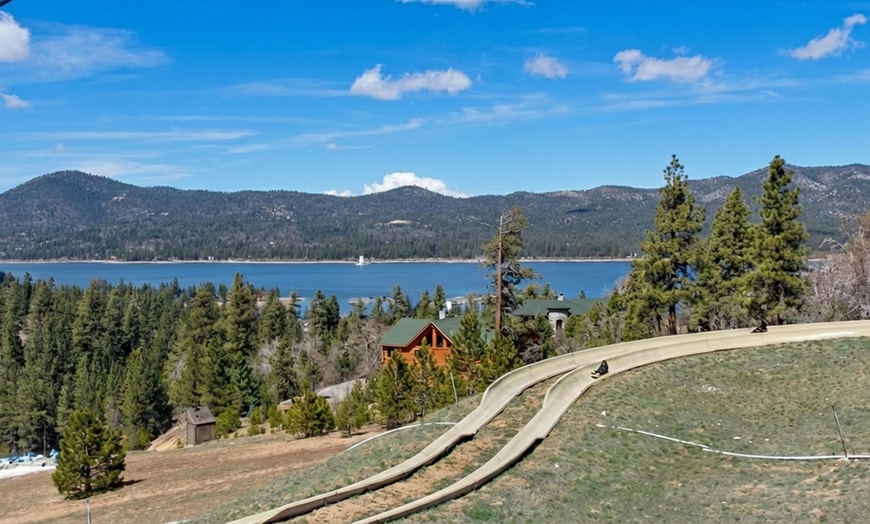Image 15: Relax by the pool with lake views and mountain breezes