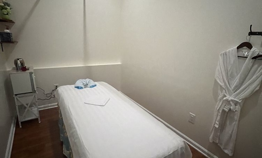 Image 9: Swedish or Deep Tissue Massages for 1 or 2 with Optional Hot Stones 