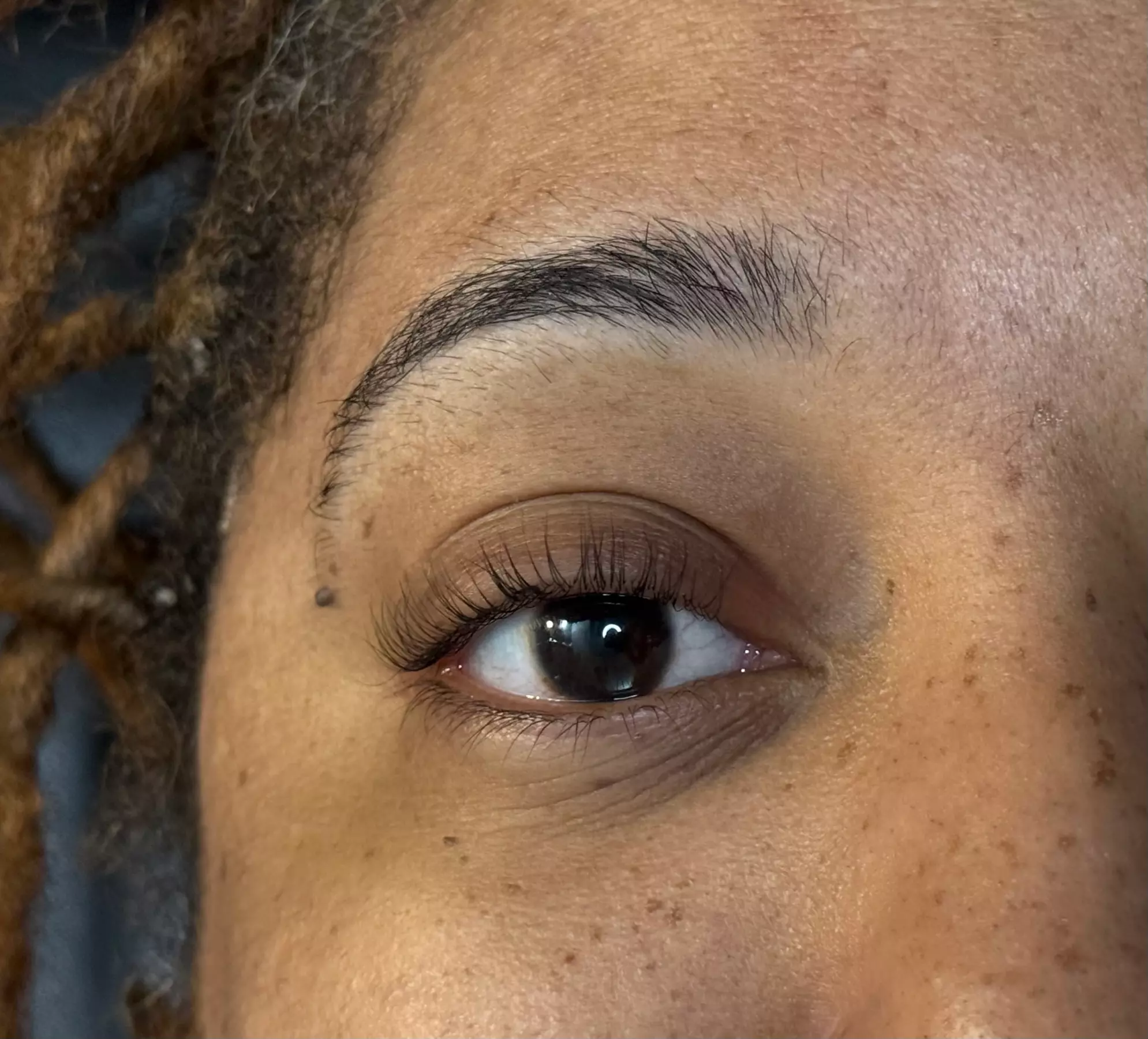Glow & Lift: Spa Facial with Brow Thread or Lash Enhancements