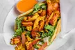 Savor the Inclusive flavors at Gaia Masala and Burger w/ $20 or $40 towards Food & Drink (Up to 33% Off) - Second Medium