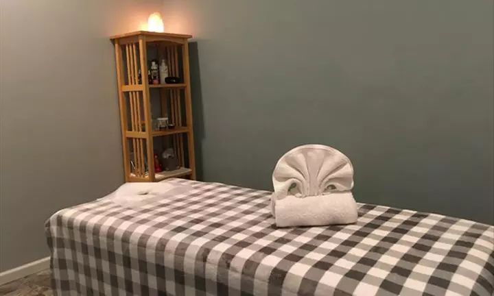 Relax with a 90-Minute Solo or Couples Massage, CBD Oil, & Hot Stones