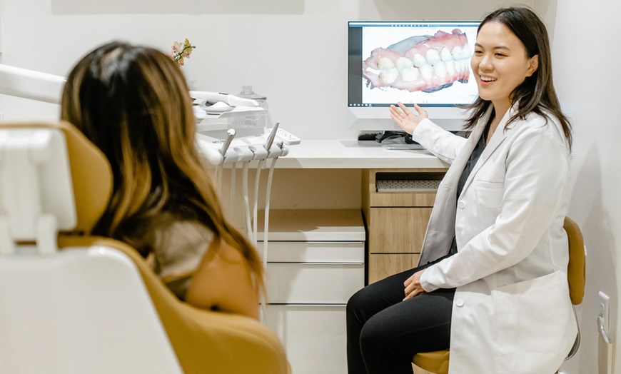 Image 1: Complete Dental Exam with Cleaning with Choice of Varnish and X-Rays