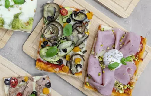 Part de pizza al taglio au cœur du quartier latin