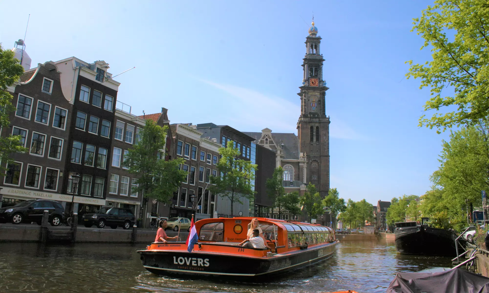 Erkunde tagsüber oder abends die ikonischen Grachten von Amsterdam