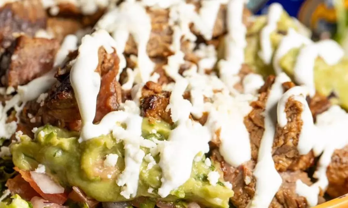 Vibrant Rooftop Dining: Choose Meals, Margaritas, or Dining Credit