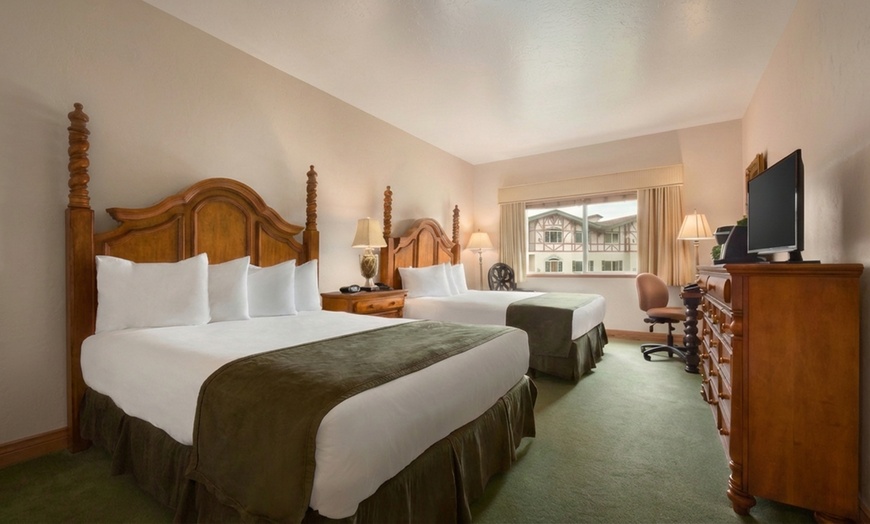 Image 6: Cozy alpine rooms, heated pool, and mountain views