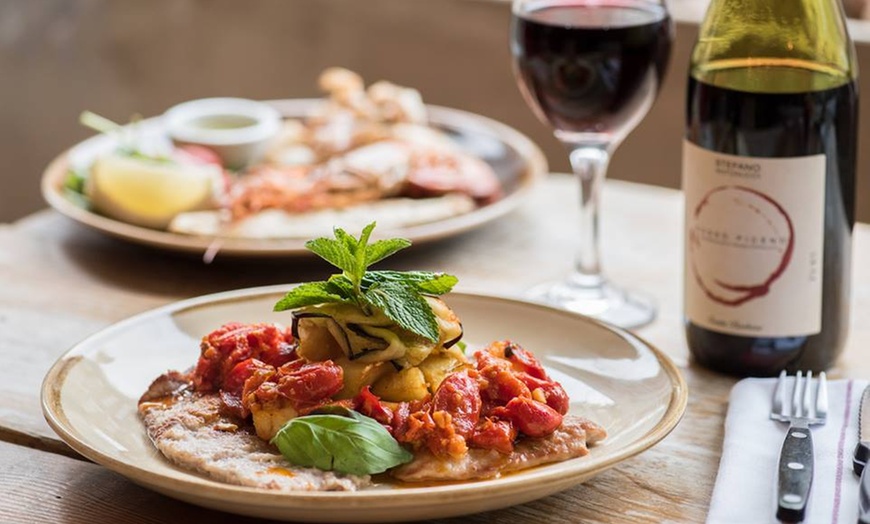 Image 1: Choice of Any Pizza or Pasta For Two or Four with Optional Glass of Wine at Amore Limoncello (Up to 47%Off)