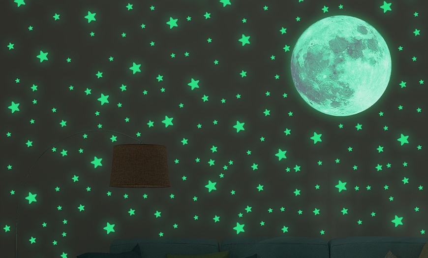 Image 1: One or Two Glow-in-the-Dark Moon and Stars Wall Sticker Sets