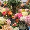 Image 2: Make a Romantic luxury floral arrangement in a relaxed workshop