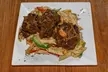 Savor & Sip Caribbean Cuisine: One, Two, or Four Drinks and Appetizers in a Cozy Atmosphere (Up To 35% Off) - Second Medium